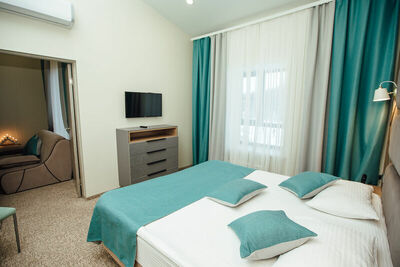 Фотография номера гостиницы Экопарк Поляны